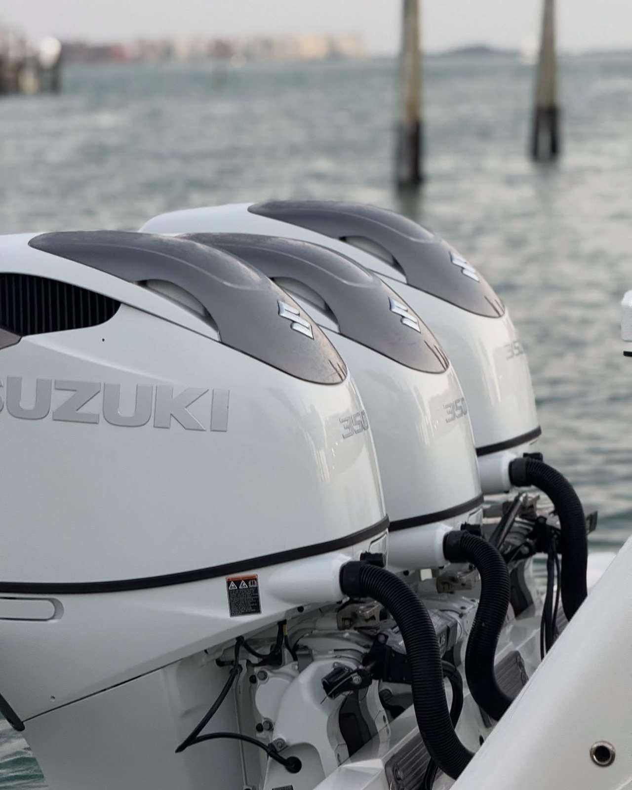 A triple outboard installation on the water